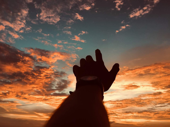 Hands Reaching Out to the Sky